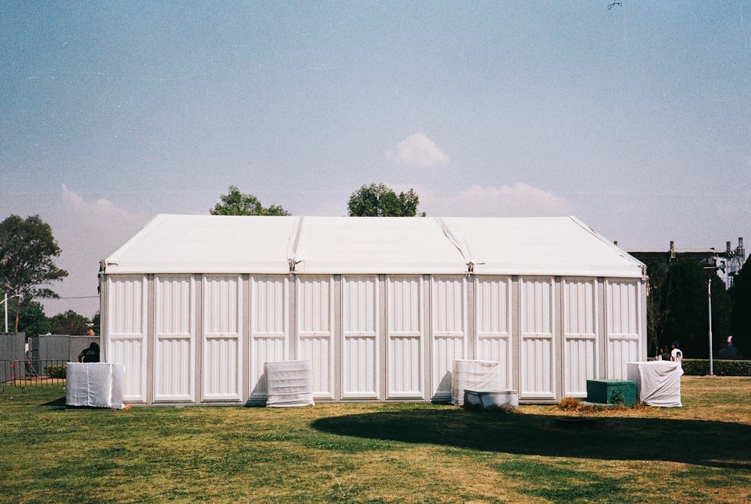 Production compound with tents, cabling and generators at an event